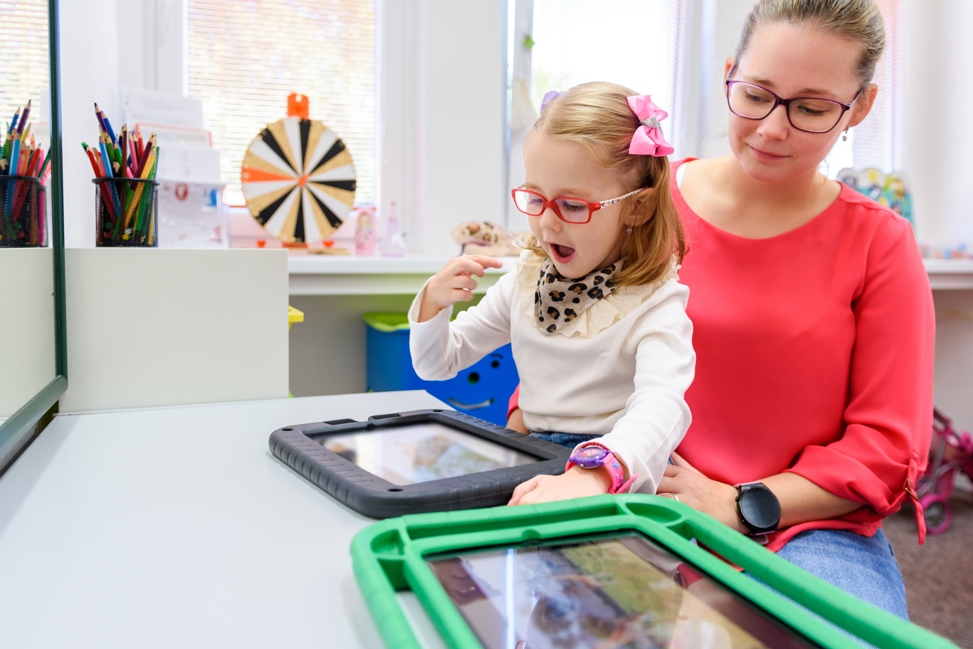Child using AAC device for communication