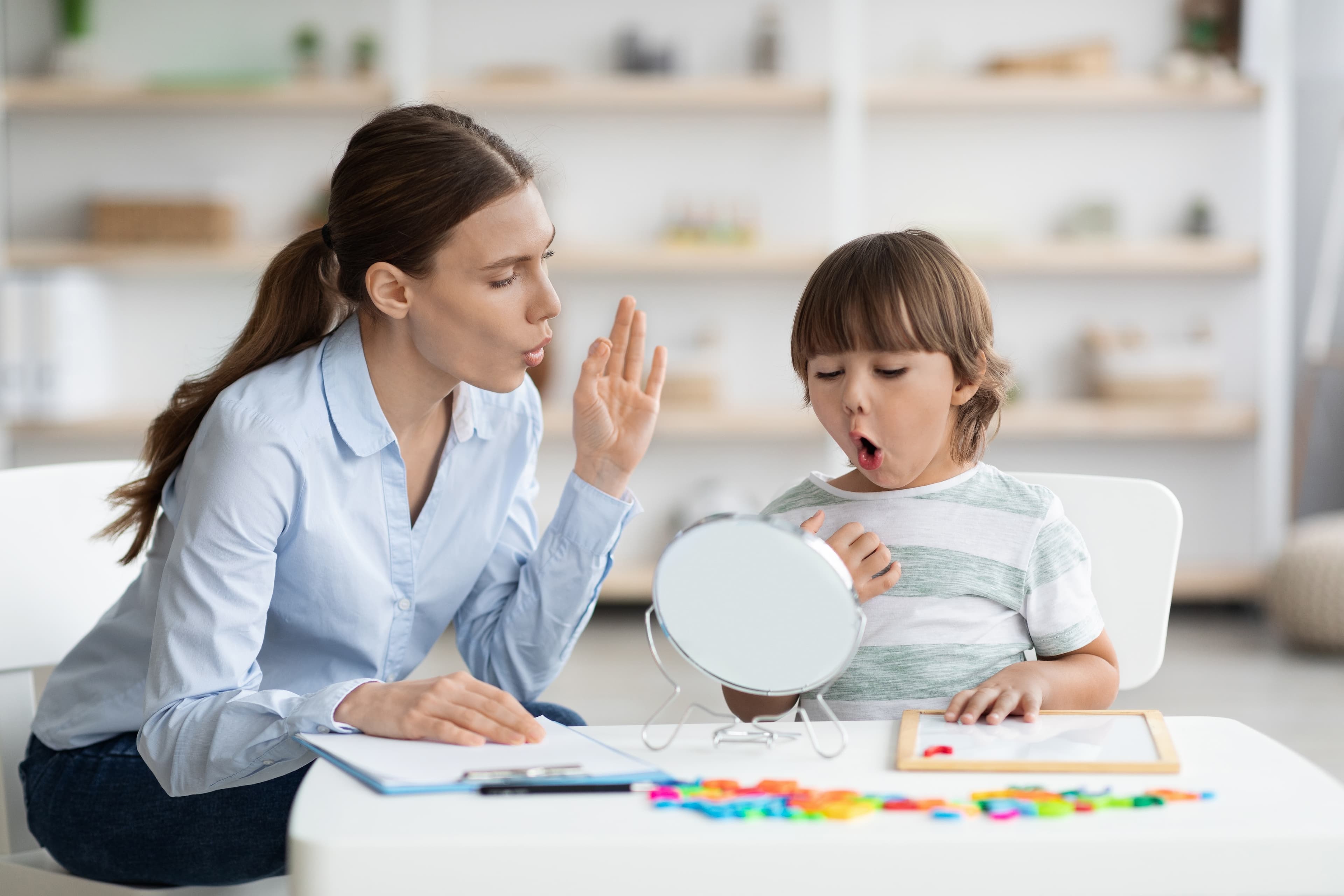 Child working on speech sounds with therapist